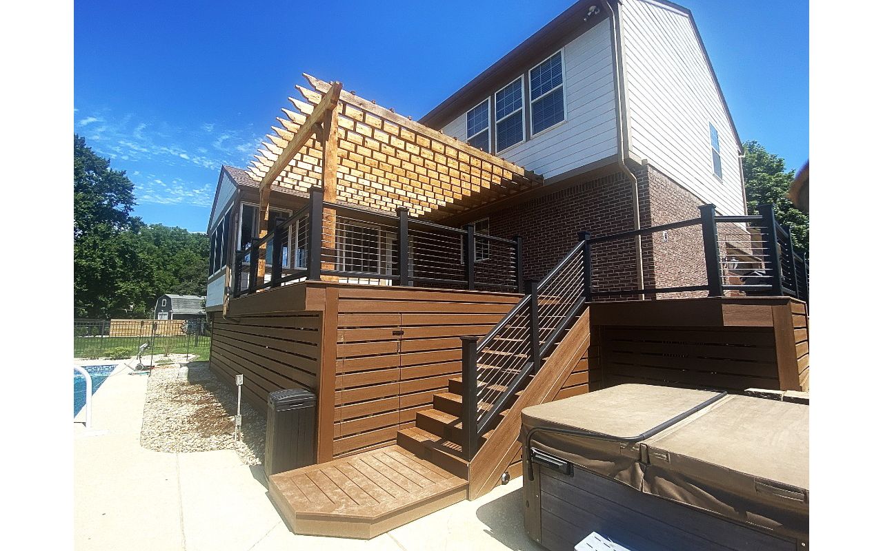 Trex Deck (Saddle) with Horizontal Deck Skirting, Trex Fascia, Trex Transcend, and Stainless-Steel Cable Rail. Rough Swan Cedar Pergola.