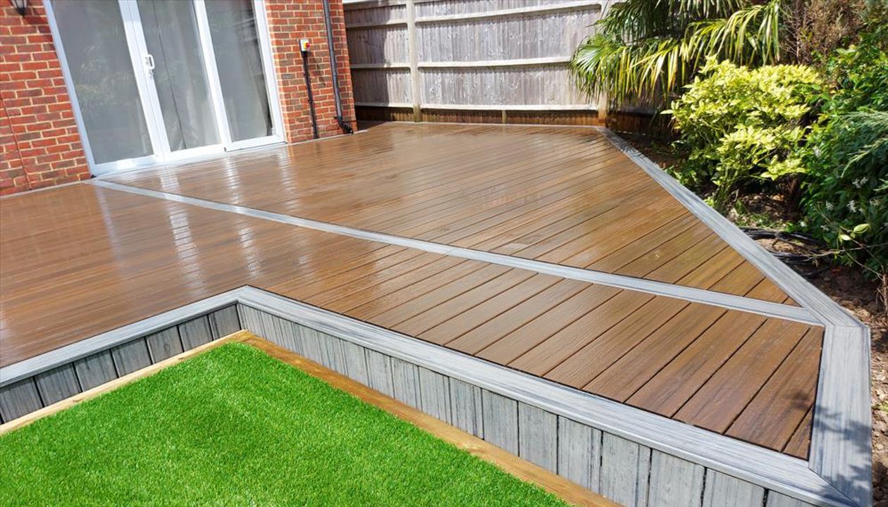 Trex Transcend Lava Rock main area. Trex Transcend island mist outer field. Project in Hamstreet