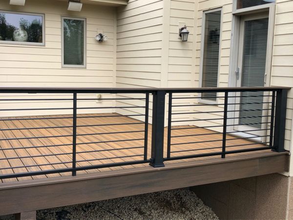 Trex/Transcend/Composite Decking and Trex/Transcend/Spiced Rum Fascia and Border with Trex/Signature/Rod-Rail (all black) and Trex/Transcend/Spiced Rum Composite Decking Cocktail Rail