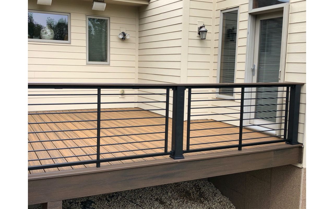 Trex/Transcend/Composite Decking and Trex/Transcend/Spiced Rum Fascia and Border with Trex/Signature/Rod-Rail (all black) and Trex/Transcend/Spiced Rum Composite Decking Cocktail Rail