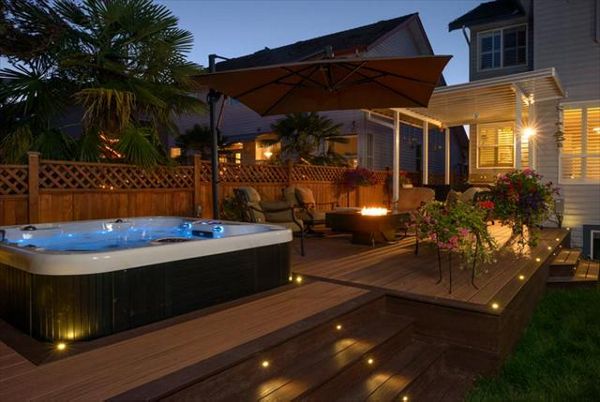 Trex Transcend deck;Tiki Torch and Lava Rock with Trex LED flush mount and riser lights - Surrey BC
