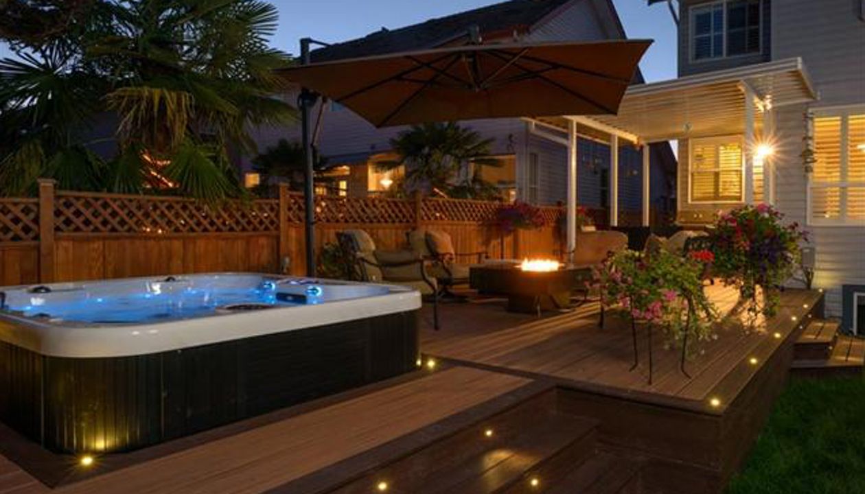 Trex Transcend deck;Tiki Torch and Lava Rock with Trex LED flush mount and riser lights - Surrey BC