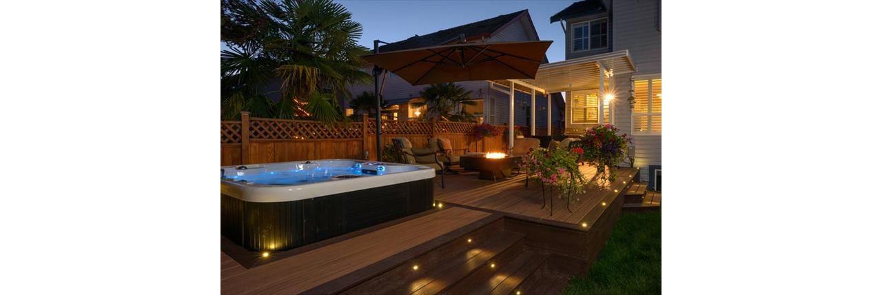 Trex Transcend deck;Tiki Torch and Lava Rock with Trex LED flush mount and riser lights - Surrey BC