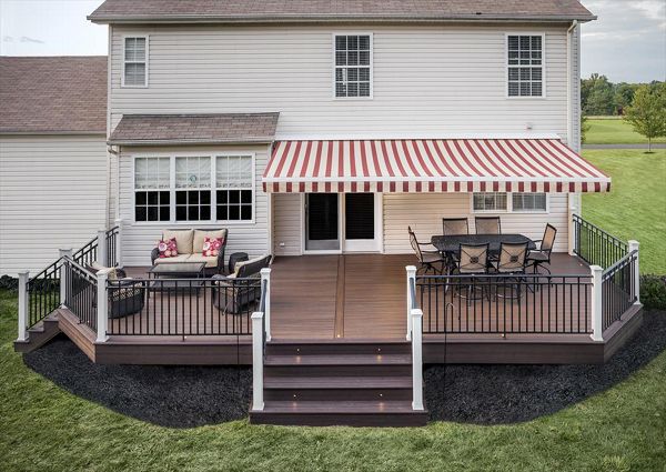 Let there be light! Trex outdoor lighting options serve both aesthetic and functional purposes in this spacious Kingwood, N.J., backyard deck which incorporates deck lighting, riser lights and floor-recessed lights from Trex.