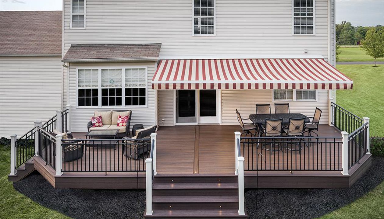 Let there be light! Trex outdoor lighting options serve both aesthetic and functional purposes in this spacious Kingwood, N.J., backyard deck which incorporates deck lighting, riser lights and floor-recessed lights from Trex.