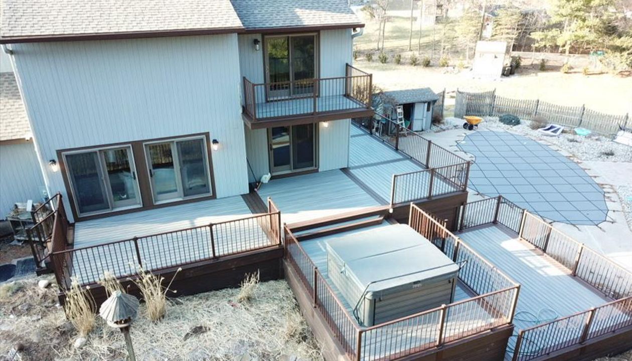 Trex Transcends Island Mist Decking with Lava Rock Board/Partitions & Skirting with Trex Signature Bronze Railing System