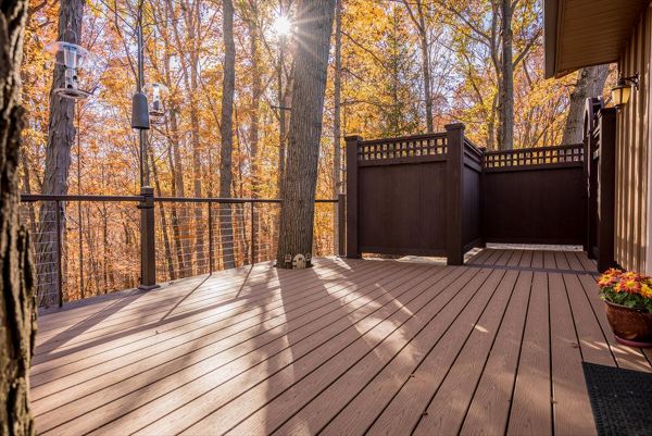 Brecksville Trex Enhance Beach Dune Deck with Vintage Lantern boarder. Custom aluminum cable rail system with under rail lighting.
