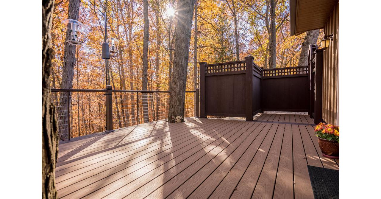 Brecksville Trex Enhance Beach Dune Deck with Vintage Lantern boarder. Custom aluminum cable rail system with under rail lighting.