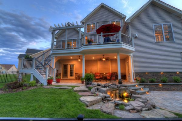 Trex Transcends Deck with Rain Escapes, Water Feature, & Custom Patio