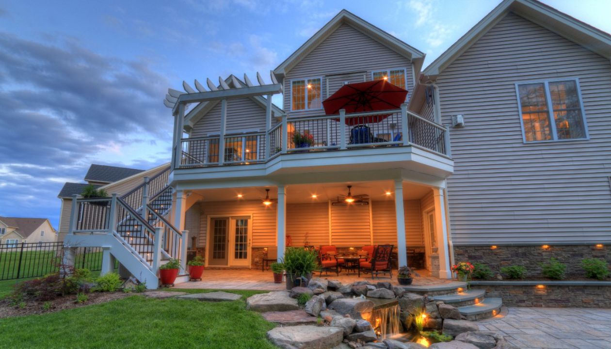 Trex Transcends Deck with Rain Escapes, Water Feature, & Custom Patio