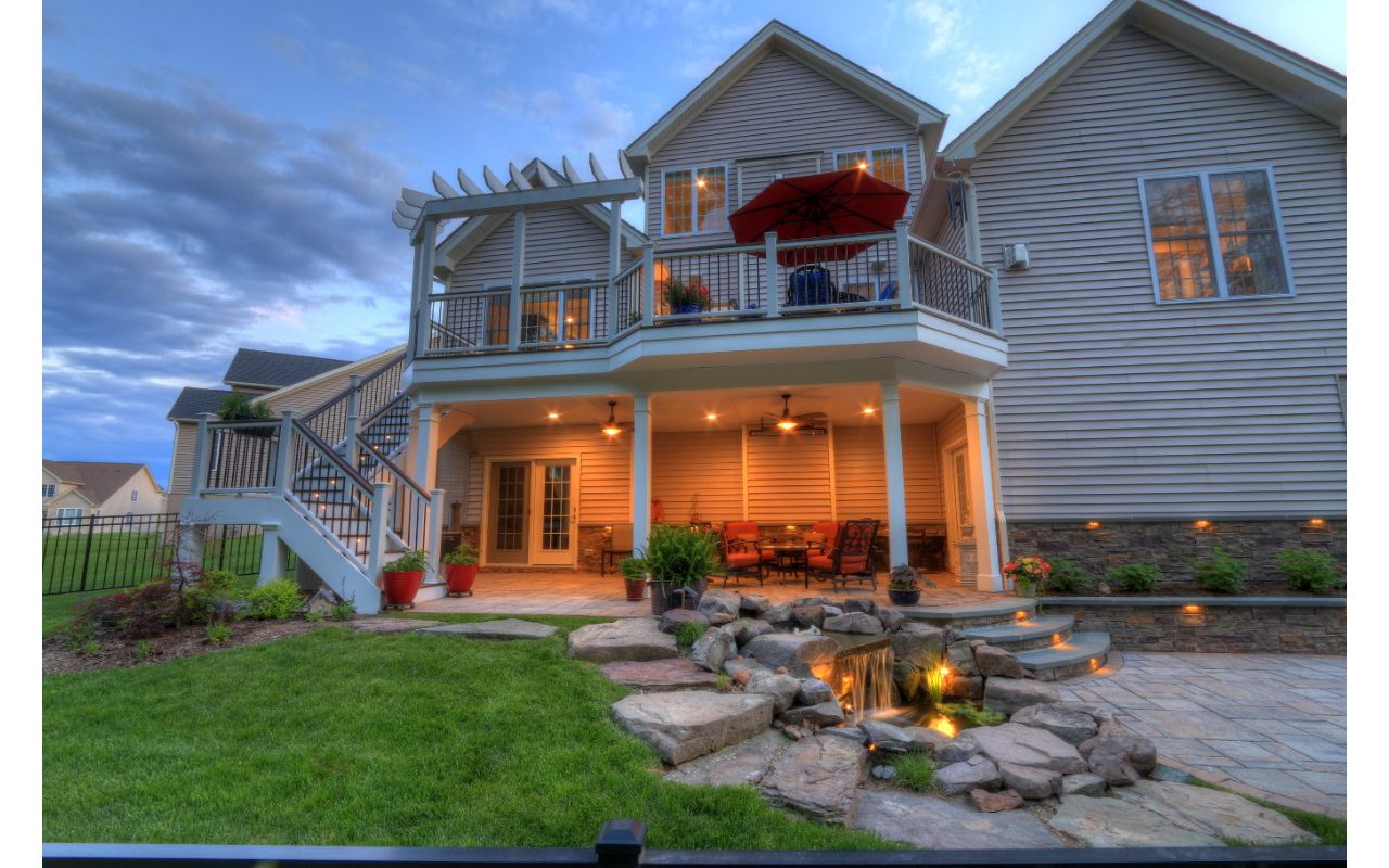 Trex Transcends Deck with Rain Escapes, Water Feature, & Custom Patio