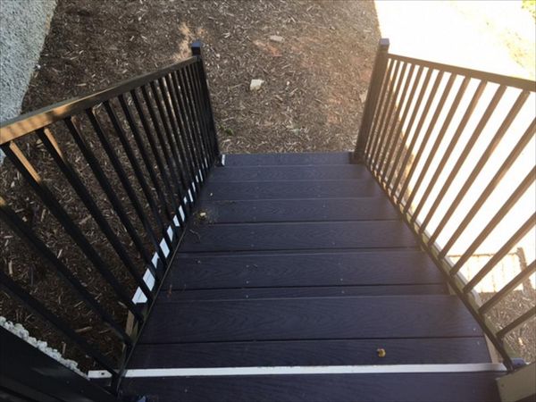 Trex Select stairs give a sturdy path to get to the ground on this cliffside home