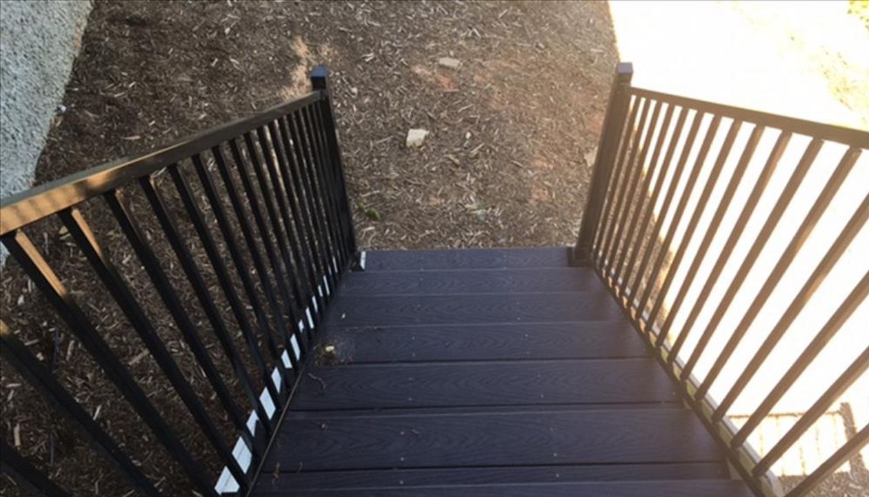 Trex Select stairs give a sturdy path to get to the ground on this cliffside home