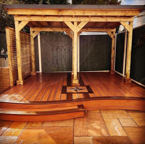 Trex Transcend Tiki Torch field with Spiced rum boarder with Star inlay and roofed Pergola fitted at Swansea