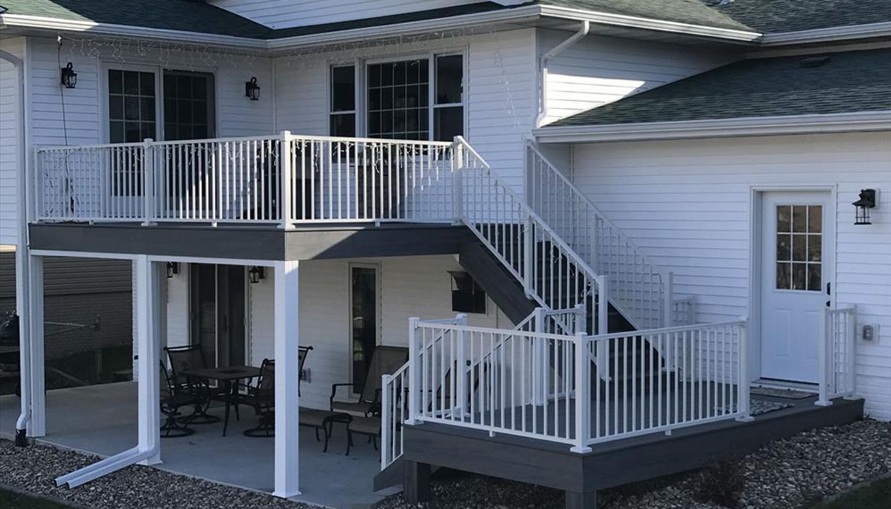 Trex Transcends Tropical Island Mist Multi-Level Deck &amp; Stairs Cedar Rapids Iowa; White Signature Aluminum Railings With Cross Over Brackets For The Stair Railings