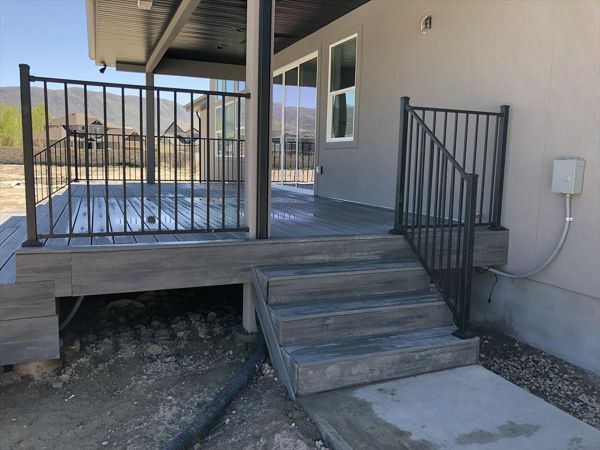 Black Flush Mount railing with Island Mist decking and Fascia.