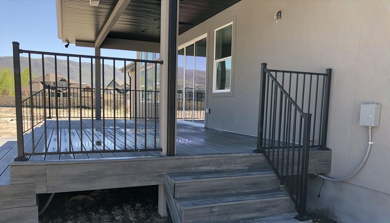 Black Flush Mount railing with Island Mist decking and Fascia.