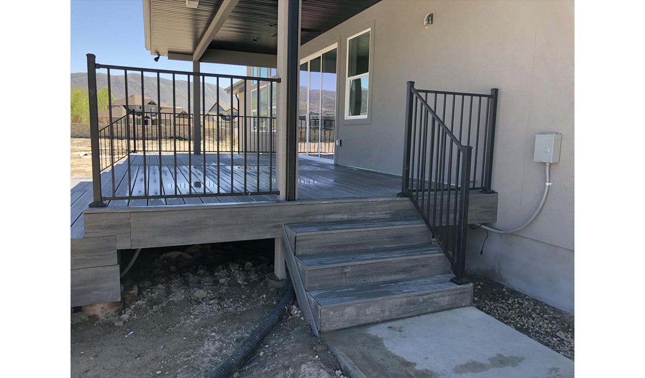 Black Flush Mount railing with Island Mist decking and Fascia.