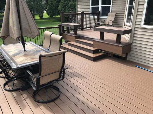 Custom Trex seating as rails by GE Contracting LLC using Trex Select vintage lantern and saddle decking in Kaukauna, WI