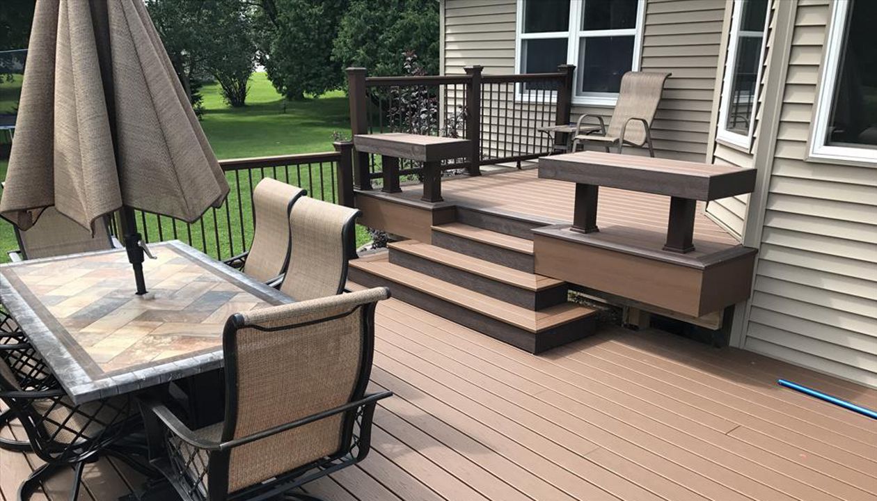 Custom Trex seating as rails by GE Contracting LLC using Trex Select vintage lantern and saddle decking in Kaukauna, WI