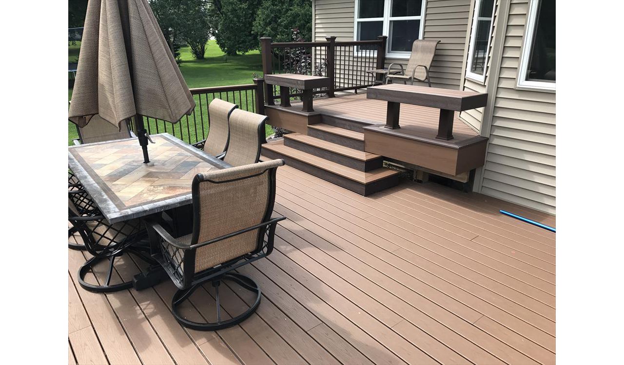 Custom Trex seating as rails by GE Contracting LLC using Trex Select vintage lantern and saddle decking in Kaukauna, WI