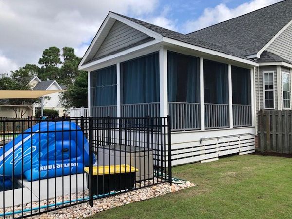 Trex Enhance Naturals Rocky Harbor deck & porch looks great with white trim