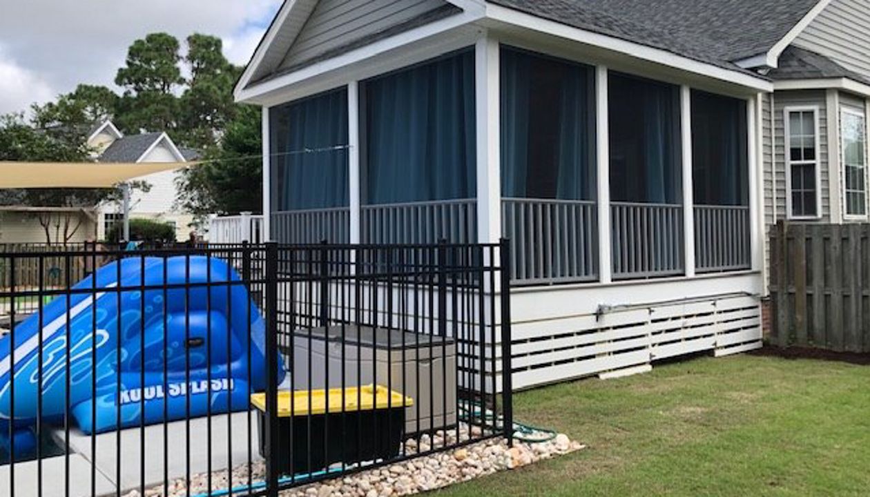 Trex Enhance Naturals Rocky Harbor deck & porch looks great with white trim
