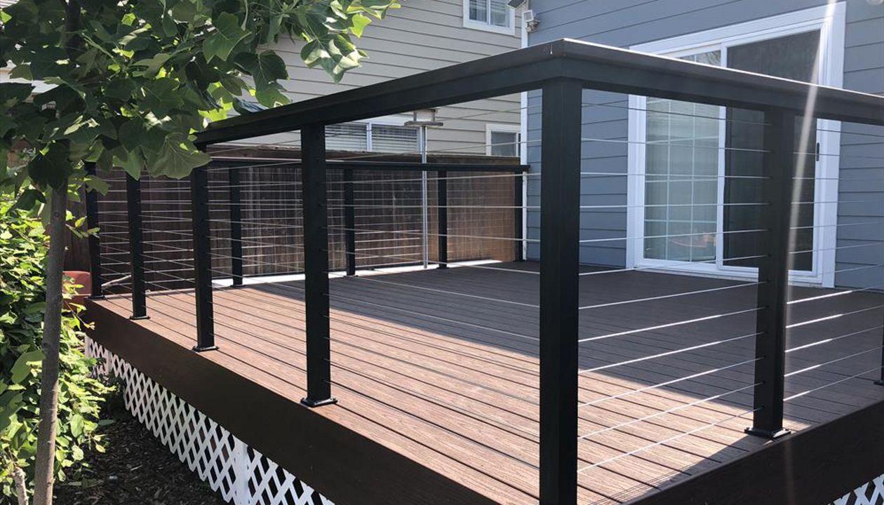 Tiki Torch Trex Transcend with stainless steel cable railing Trex cocktail rail Arroyo Grande