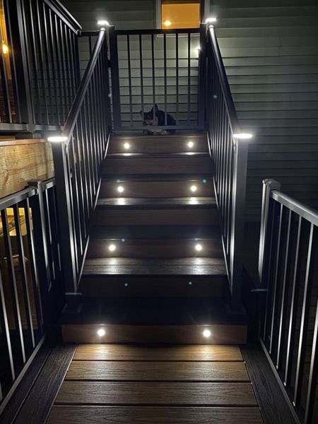 Two-Tone Low-Maintenance Trex Transcend Composite Deck Stairway with Aluminum Railing & Gate and Super Cool LED Lighting for Safety and Ambiance in the Rochester, MN Area built by Schmidt Carpentry, LLC