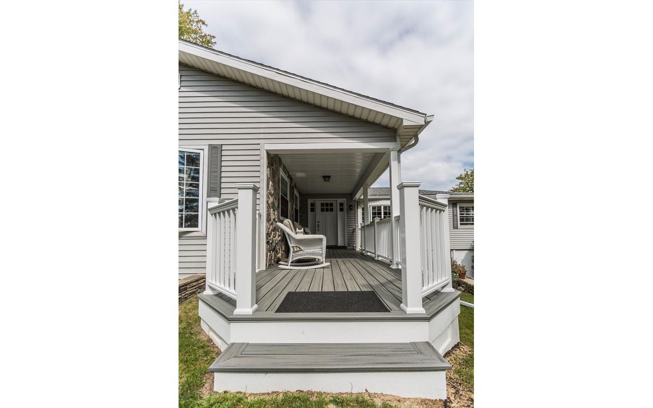 Front porch with custom front walk out.