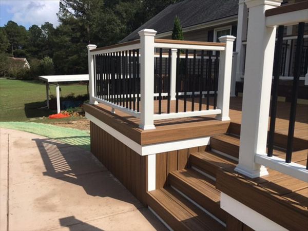 Trex Transcend Havana Gold fascia board finishes off these stairs to the pool area perfectly.