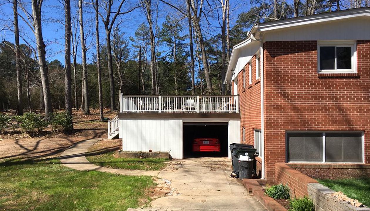 This Trex Transcend deck features Trex RainEscape drainage system to keep the garage underneath dry and clean