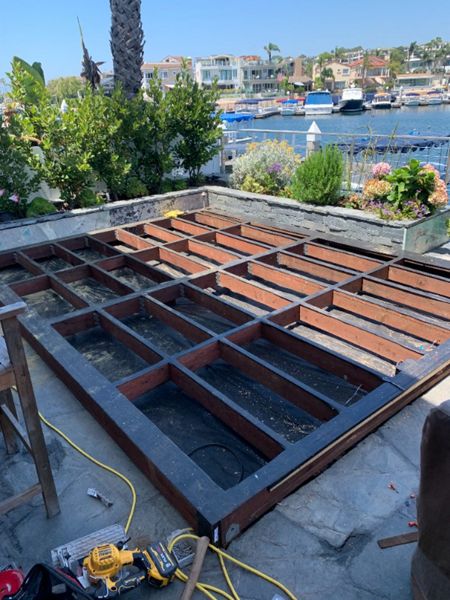 Trex decking being laid on top of framing