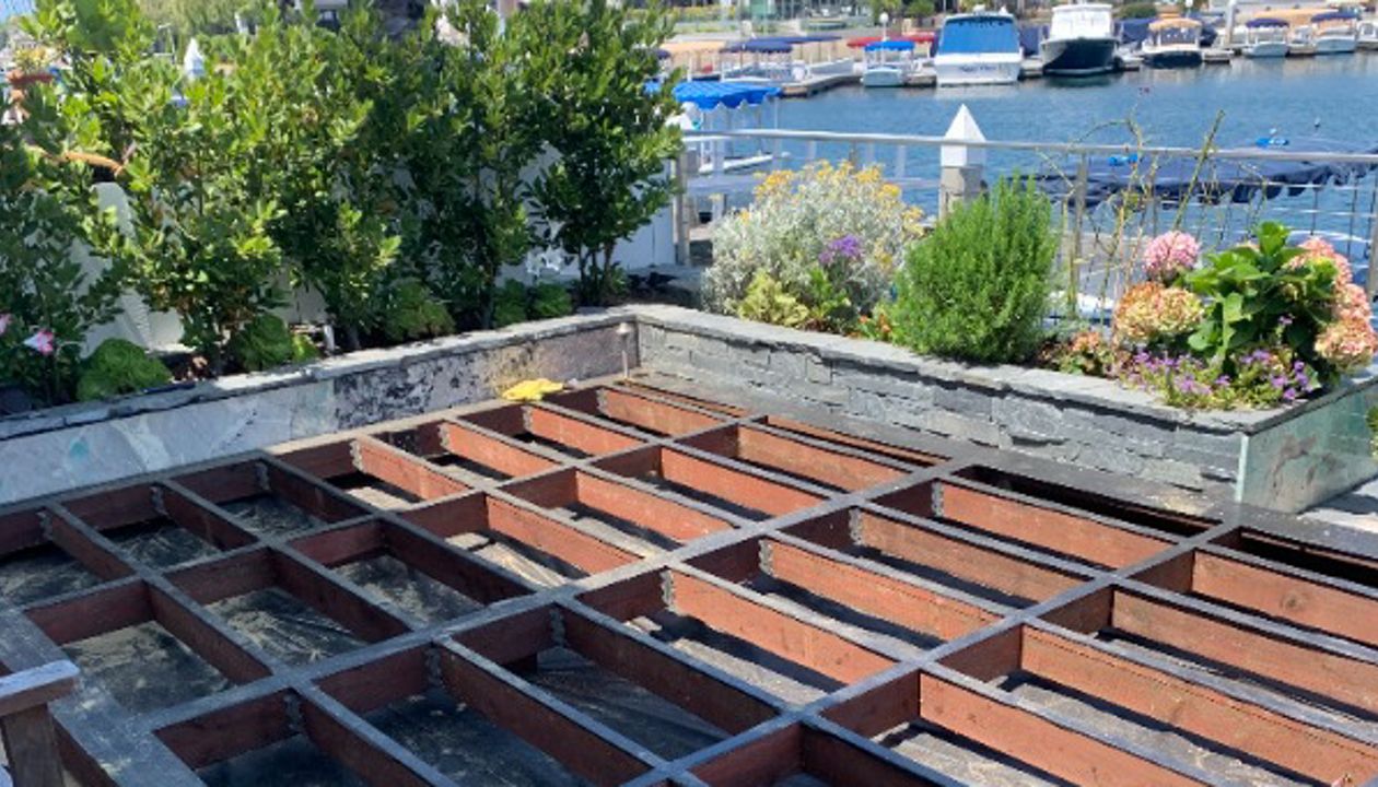 Trex decking being laid on top of framing
