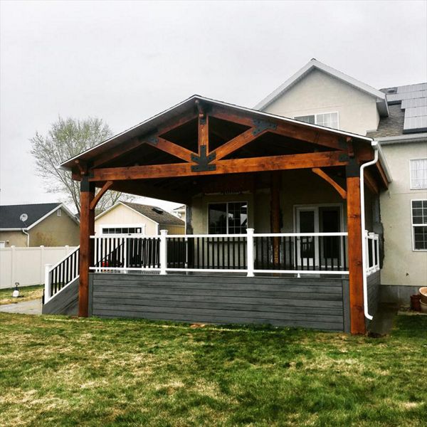 island mist decking, trex transcend rail and a timber frame roof cover