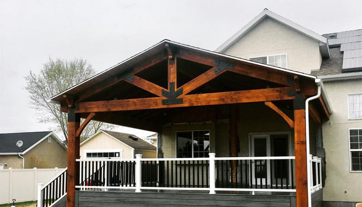 island mist decking, trex transcend rail and a timber frame roof cover