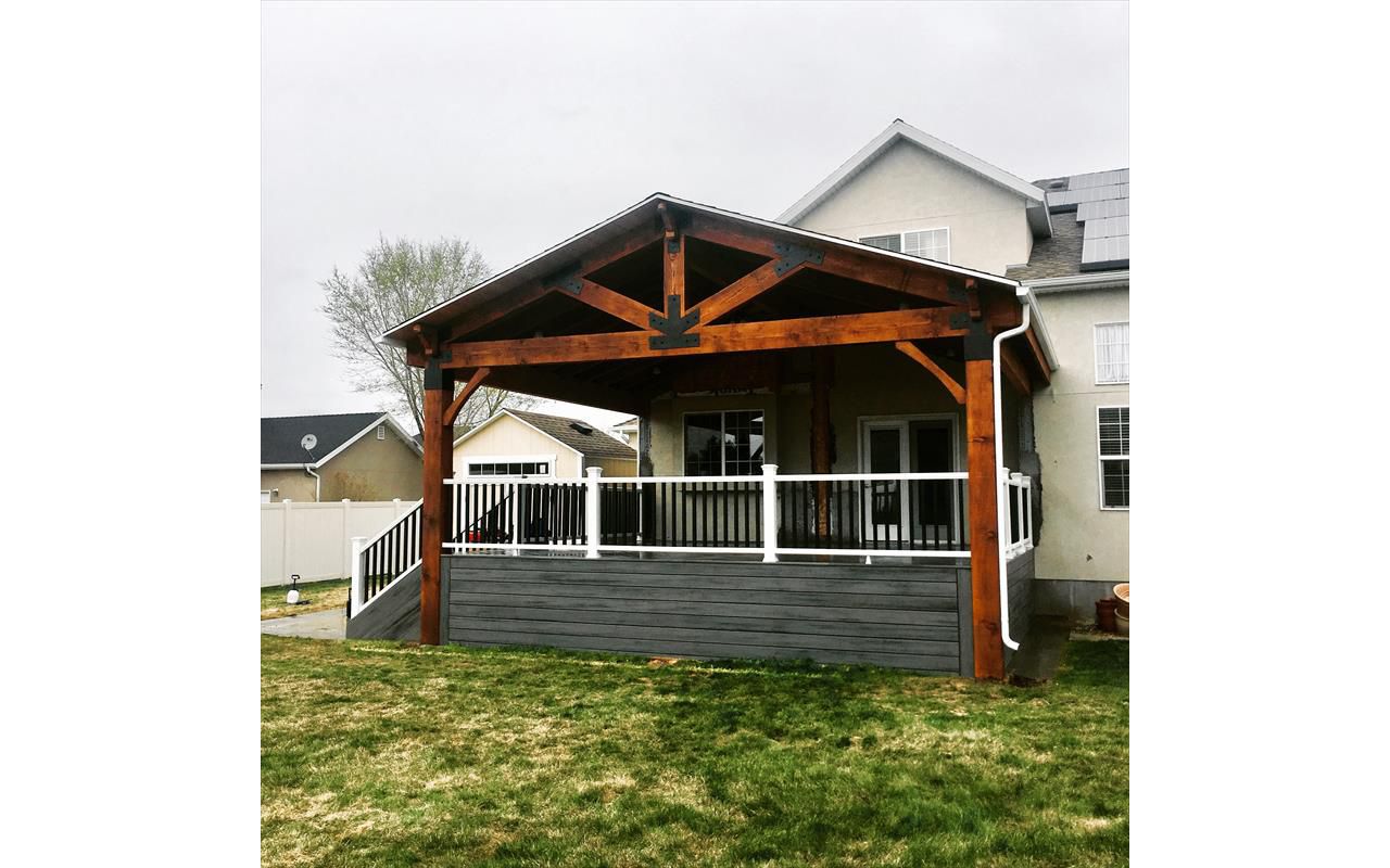 island mist decking, trex transcend rail and a timber frame roof cover