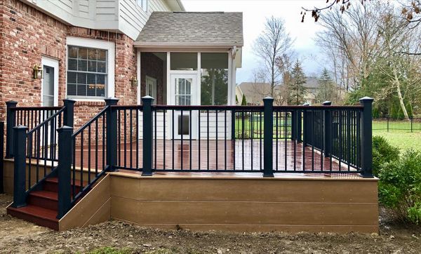 Trex Select Maderia w/ Beach Dune border. Trex Signature aluminum railing with cocktail board