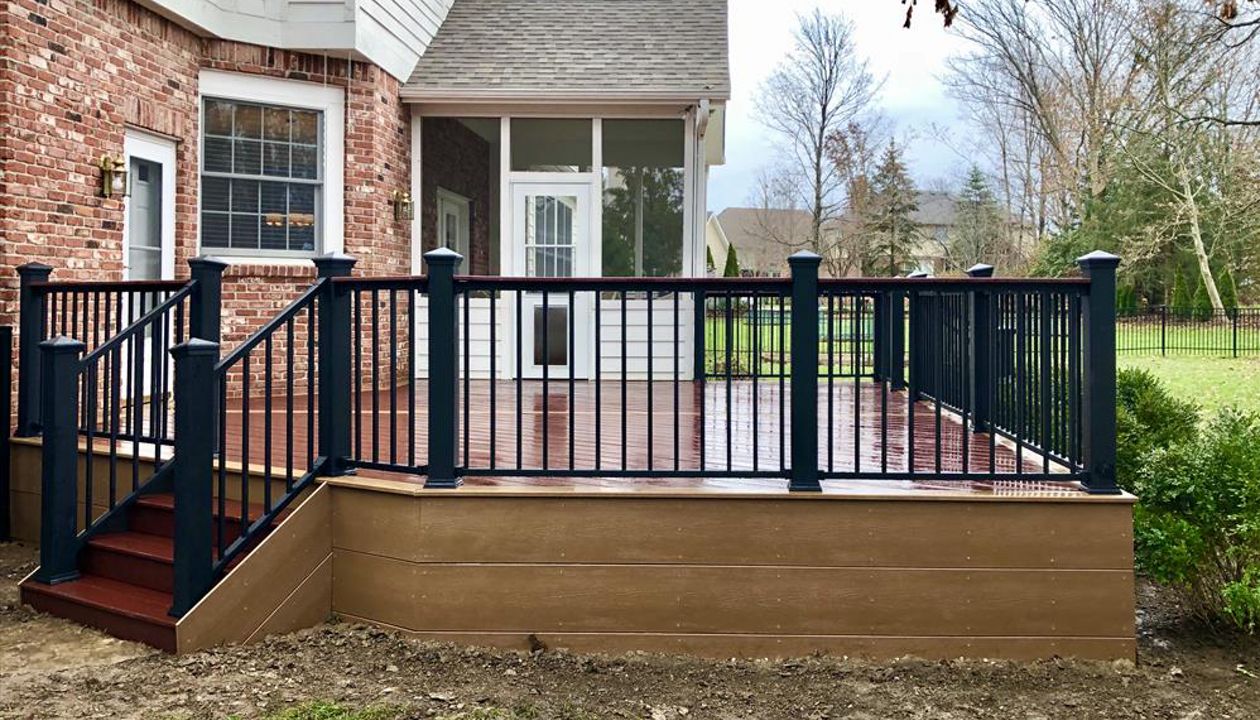 Trex Select Maderia w/ Beach Dune border. Trex Signature aluminum railing with cocktail board