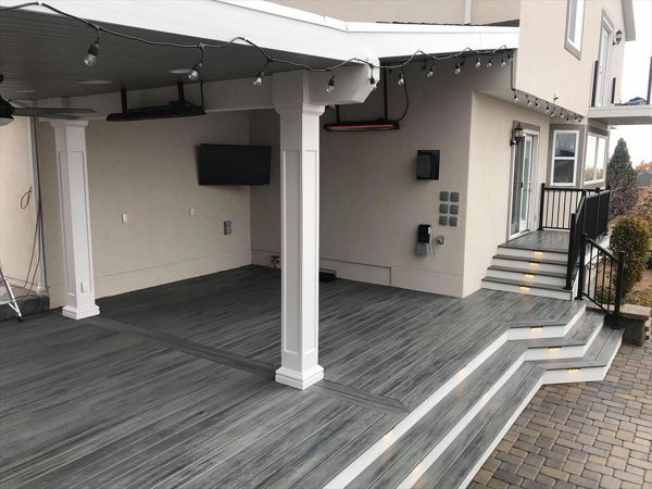 island mist with white trex fascia, deck lighting, roof build with ceiling fans, drop heaters and tv