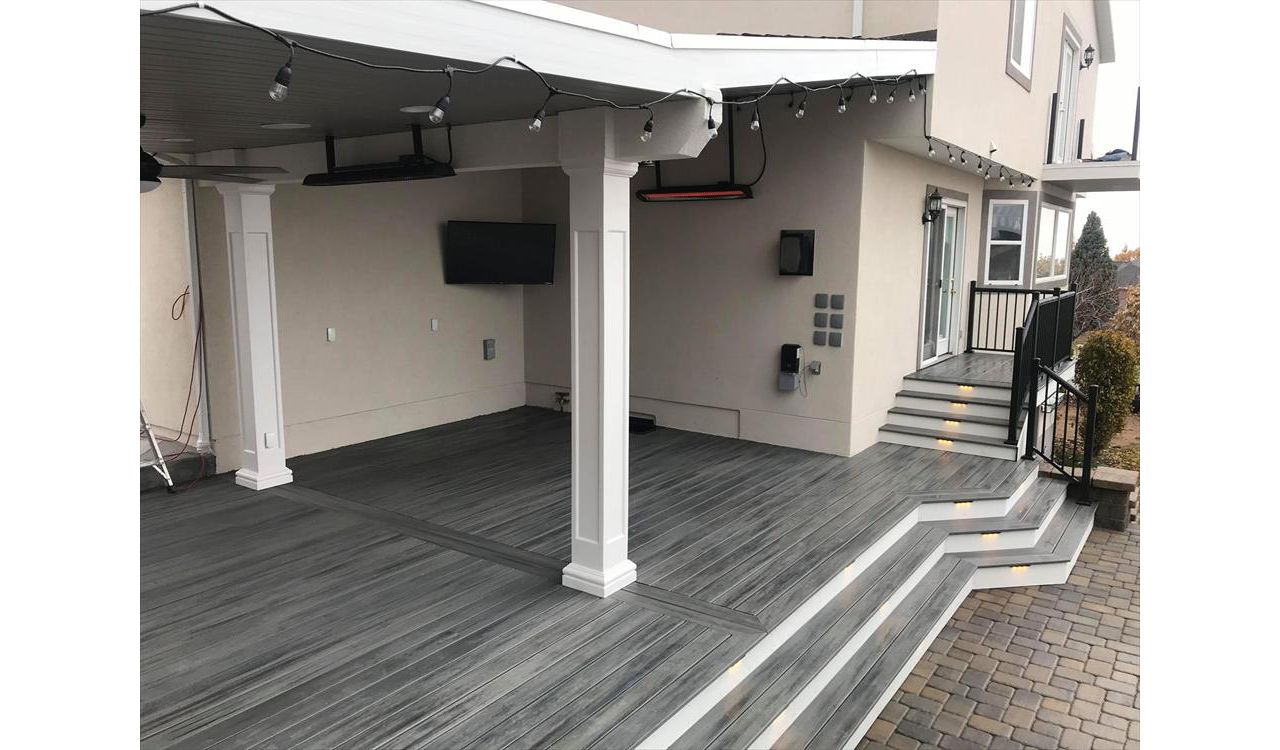 island mist with white trex fascia, deck lighting, roof build with ceiling fans, drop heaters and tv
