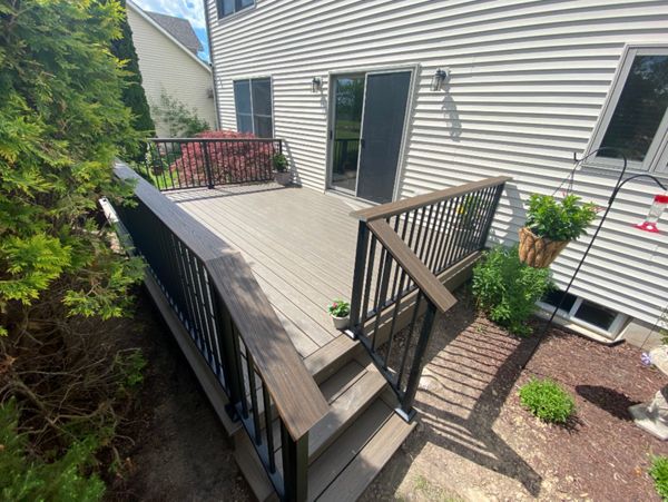 Overhead Enhanced Naturals - Coastal Bluff decking, picture frame and fascia with a Transcends - Spiced Rum drink rail