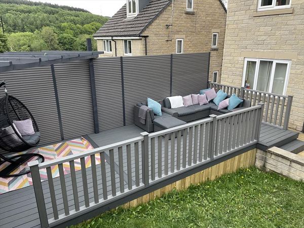 Trex Enhanced Basics in Clam shell also showing Timber Pergola & Composite slatted fencing.