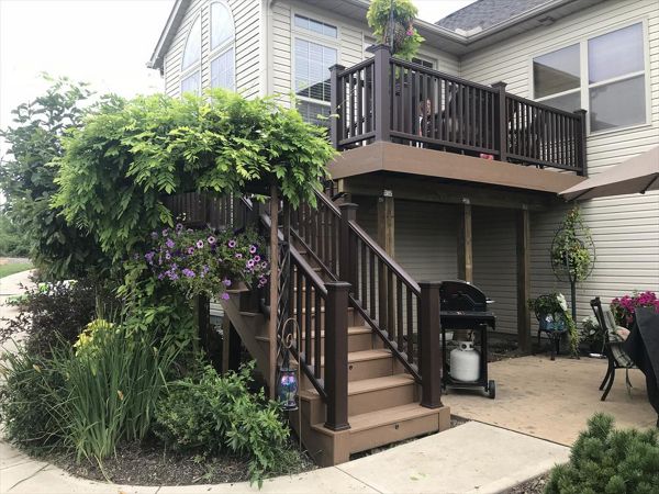 Trex's classic earth tones like the ones used on this deck fit perfectly in floral areas.