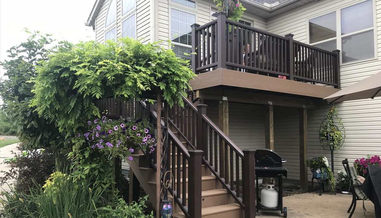 Trex's classic earth tones like the ones used on this deck fit perfectly in floral areas.
