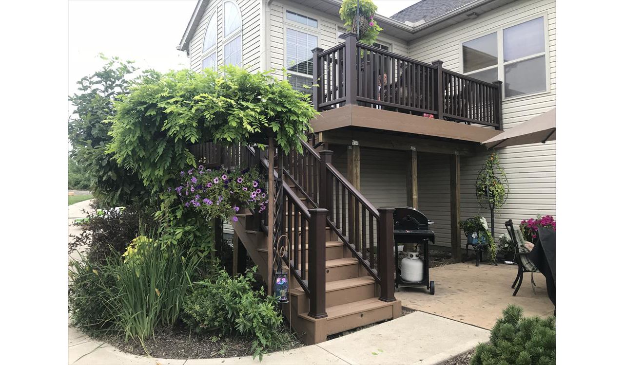 Trex's classic earth tones like the ones used on this deck fit perfectly in floral areas.