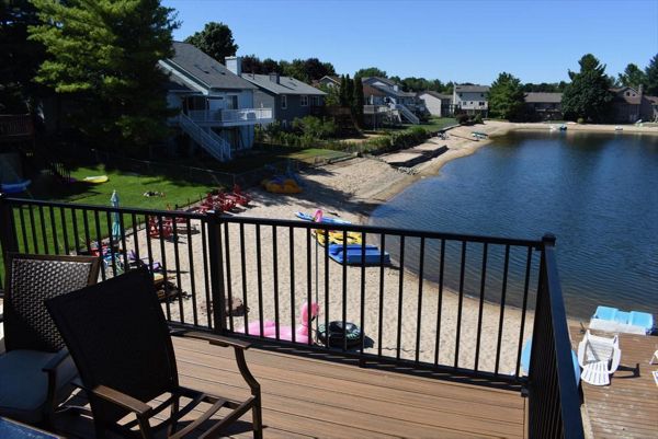 Waterfront custom designed Trex deck. Serving Grandville, Wyoming, Grand Rapids, Forrest Hills, Rockford, and surrounding areas.