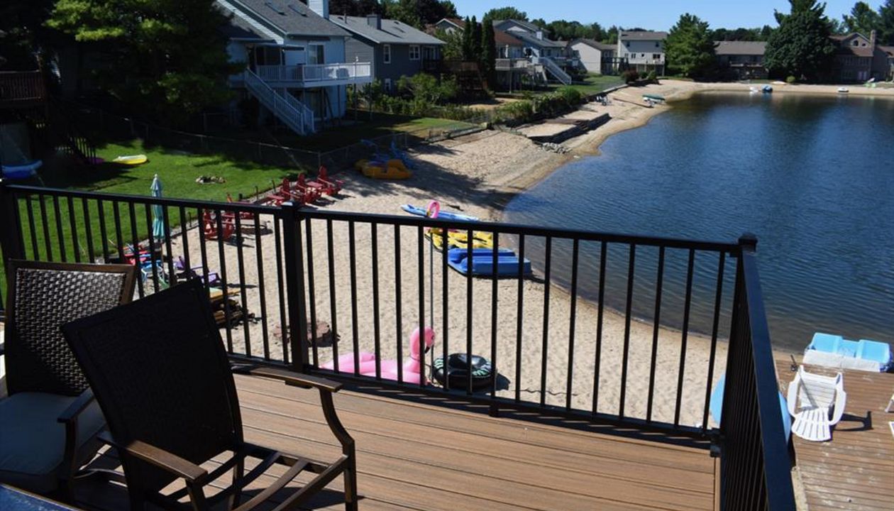 Waterfront custom designed Trex deck. Serving Grandville, Wyoming, Grand Rapids, Forrest Hills, Rockford, and surrounding areas.