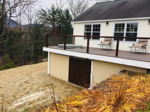 This deck has three hundred square feet of the rain escape system. This gave my customer a shed are under the deck for storage that other wise would be wasted space .