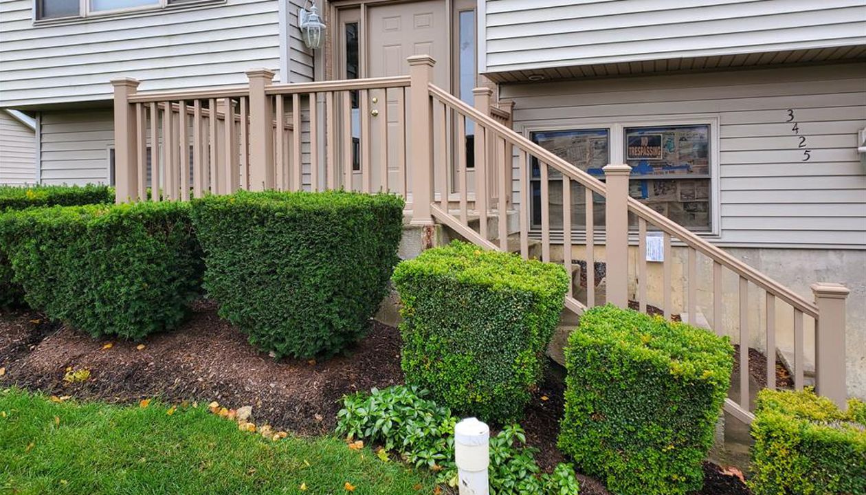 Transcend Railing in Ropeswing replaced an old wooded guardrail and staircase railing in McHenry, IL.  Use of Trex structural mounting post secure the guard rails to the concrete front stoop and steps.